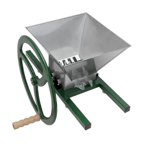 Manuell fruktkross i rostfritt stål med gröna detaljer samt ett stort vevhjul med trähandtag