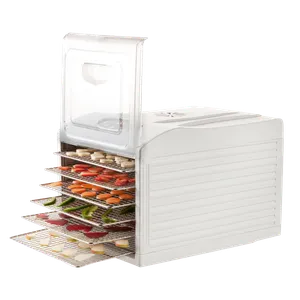 Frukt- og sopptørkeren med forlengede rustfrie rist, på ristene ligger fersk frukt og grønnsaker i skiver