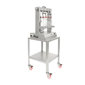 Vakuumfyllaren sett från sidan, på sidan sitter svarta handtag för att enkelt kunna lyfta maskinen