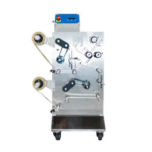 Halvautomatisk mærkningsmaskine til flasker og dåser, hvor en etiketrulle placeres