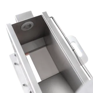 Lähikuva annostelijan sisäosasta, jossa on avattava ala- ja yläosa