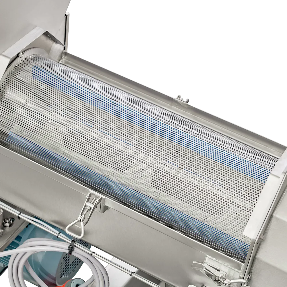 En luge, der kan åbnes, fjernes på maskinen for at afsløre den indvendige cylindriske sigte