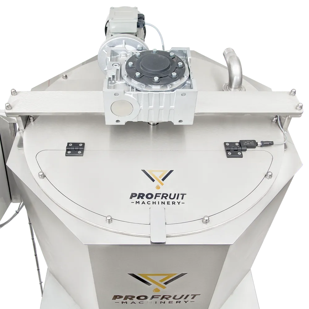 Marmeladekoker sett ovenfra, med åpningsbart lokk på toppen og motor og girkasse for omrører