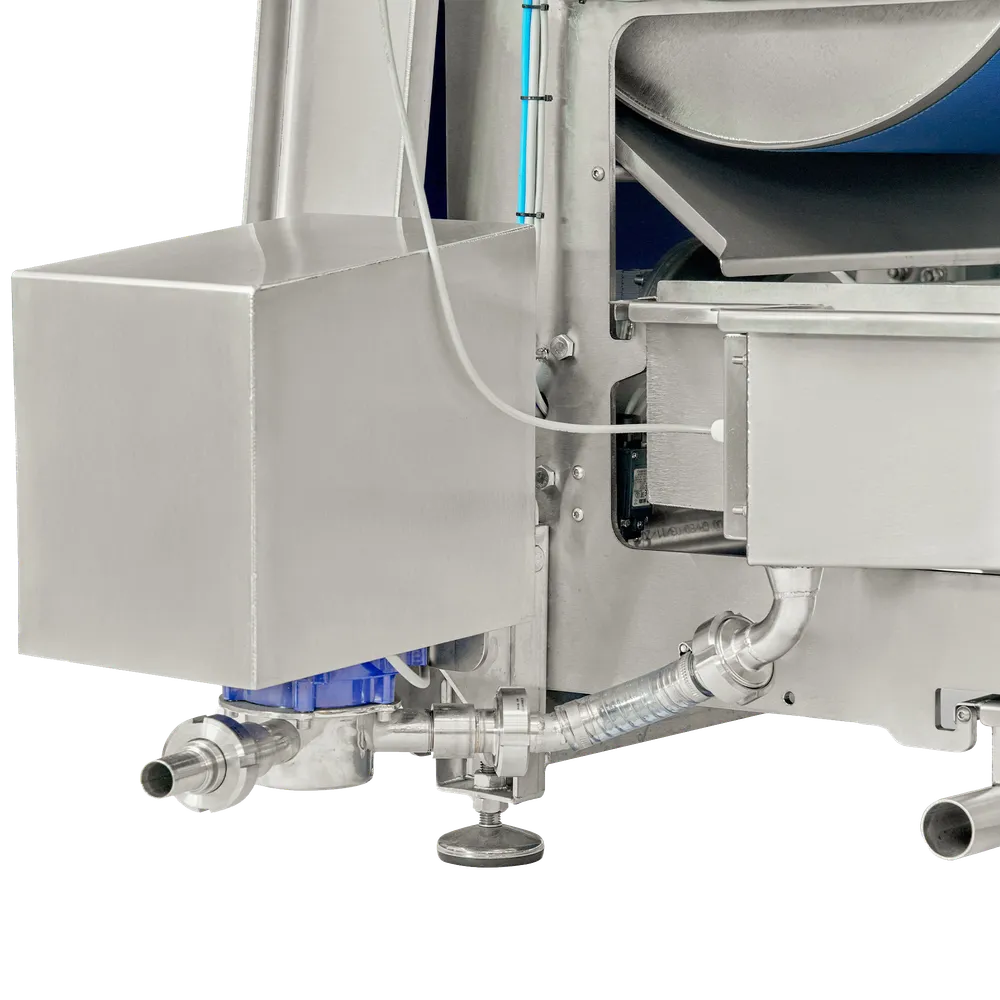 Hihnapuristimen alla oleva keräyslaatikko, johon on kiinnitetty pumppu